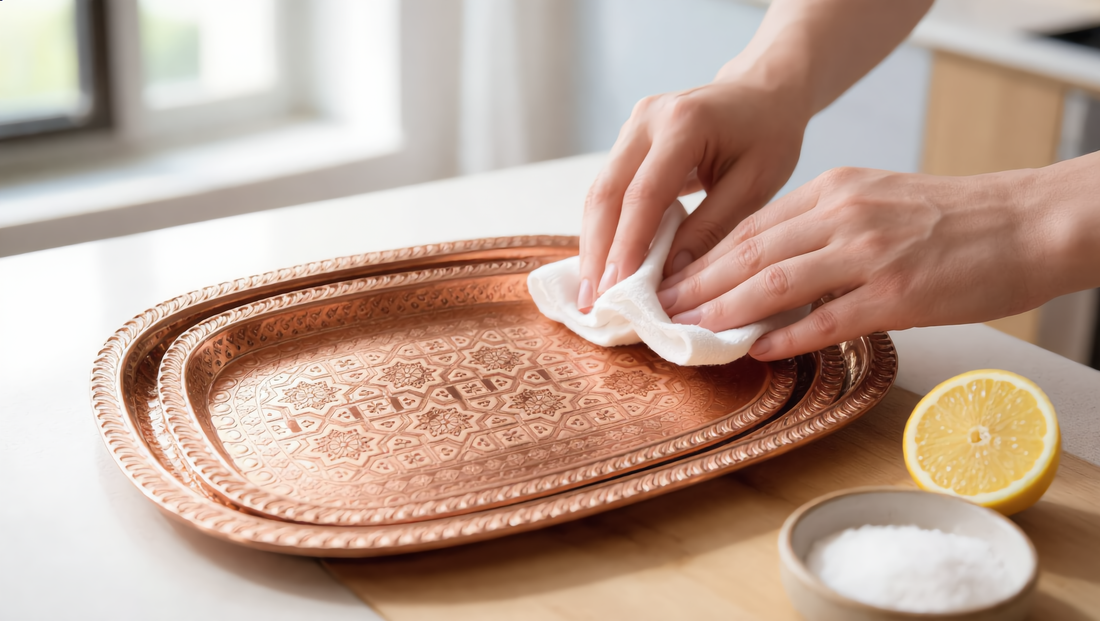 Polishing a hammered copper tray with a cloth, lemon and salt