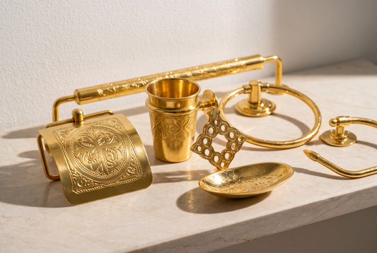 Close-up of hand-engraved brass bathroom accessories