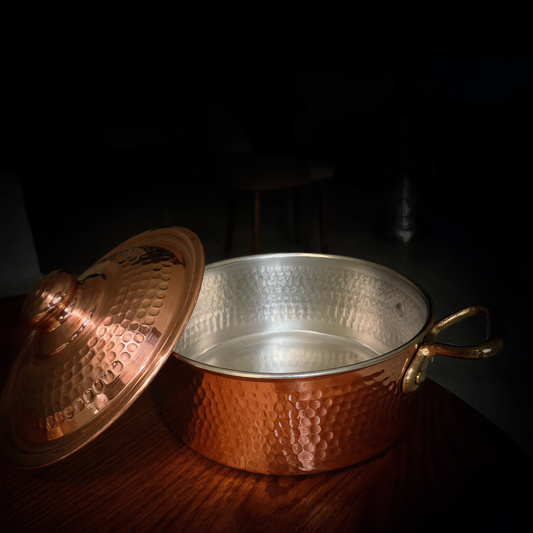 Kanz copper pot open, showing its tinned interior, lid beside it