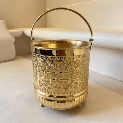 Large engraved brass hammam bucket in a Moroccan hammam