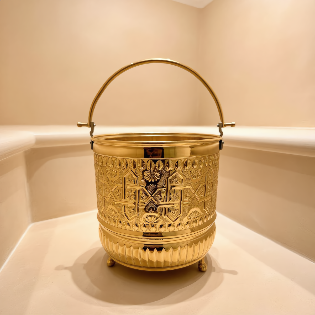 Medium engraved brass hammam bucket in a Moroccan hammam