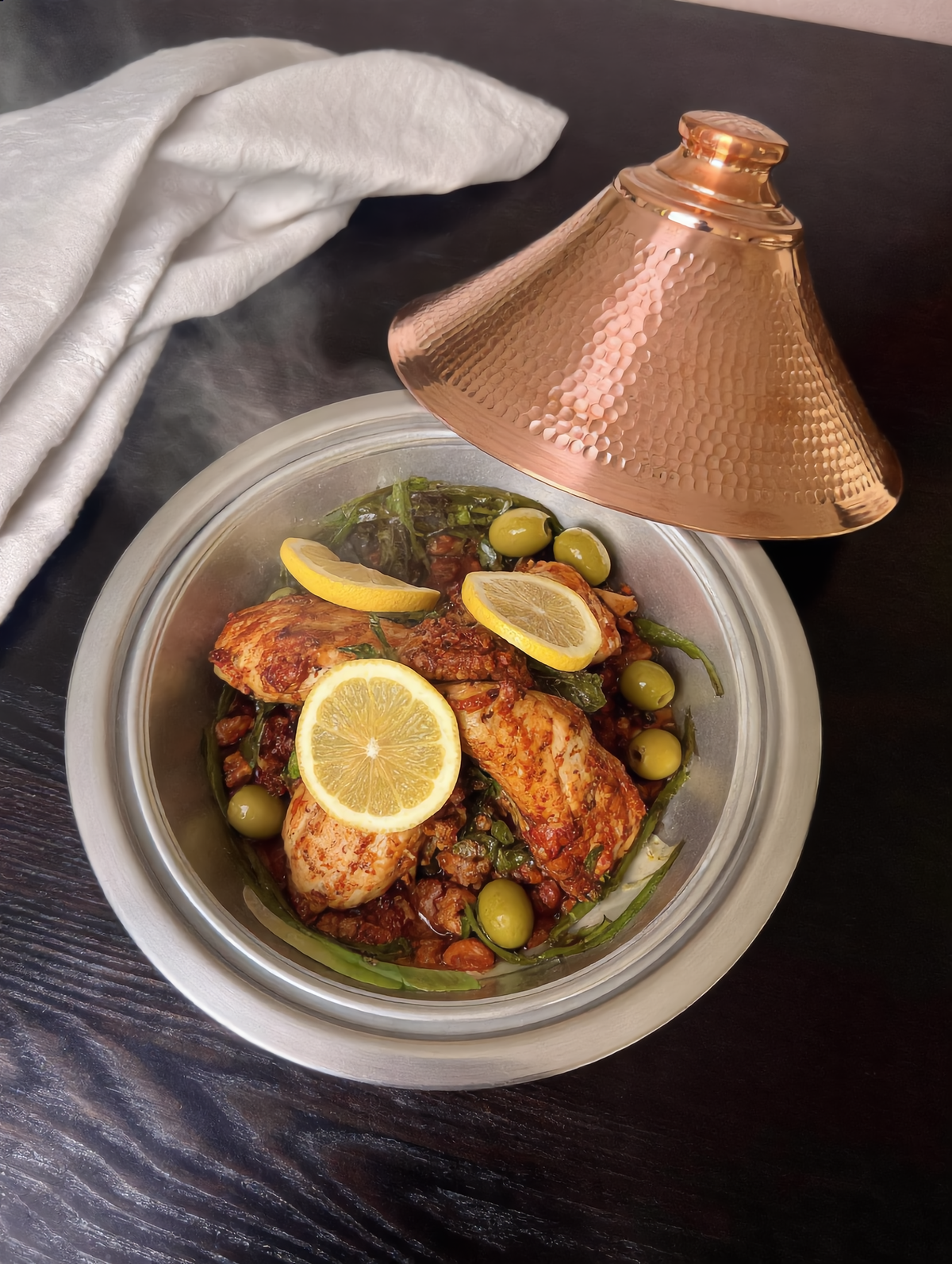 Open copper tajine with chicken, preserved lemon and olives, Cuivra