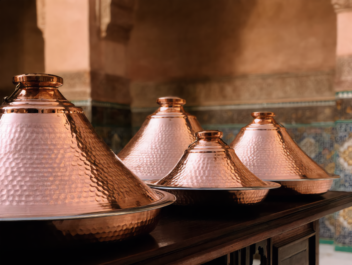 Dyafa copper tajines in four sizes in a Moroccan riad, Cuivra