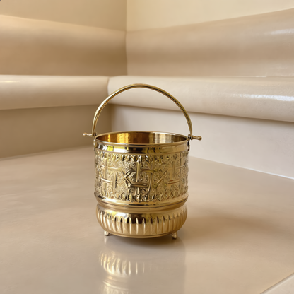 Small engraved brass hammam bucket in a Moroccan hammam